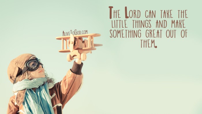 Happy kid playing with wooden toy airplane in autumn