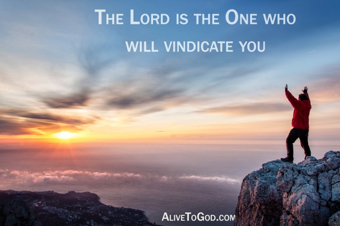 A man standing at mountain top with open arms set against a beautiful sunrise, feeling freedom